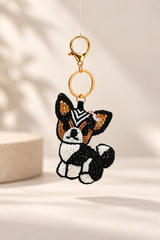 Milo black and white beaded dog keychain with tan ears and pink bow