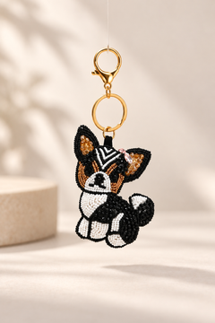 Milo black and white beaded dog keychain with tan ears and pink bow