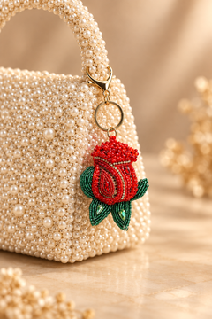 Red Rose beaded keychain with green leaves and gold tone lobster clasp