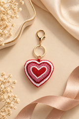 Red and white beaded heart keychain with pearl accents and gold lobster clasp