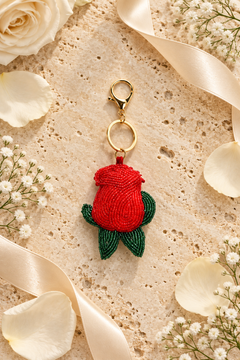 Rosebud beaded bag charm in red with green leaves