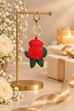 Rosebud beaded bag charm in red with green leaves