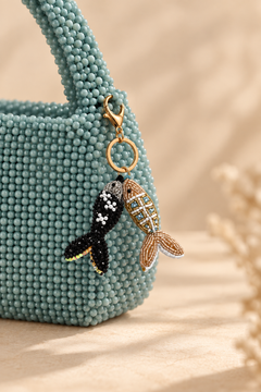 Twin Fish beaded keychain with black pearl beaded fish and gold crystal lattice fish.