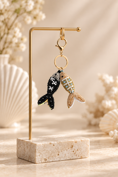 black beaded fish with white pearl beads and silver tone head