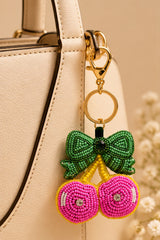 Pink beaded cherry keychain with green bow
