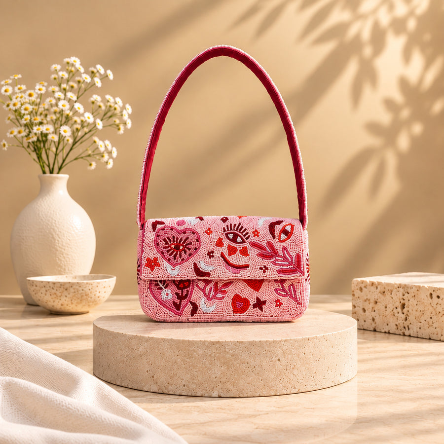 Pink beaded shoulder bag with evil eye, heart, moon and star embroidery