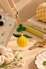 Lemon beaded keychain in yellow with green leaves
